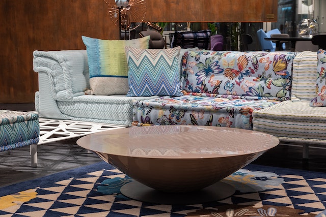 A colorful sofa near the round table