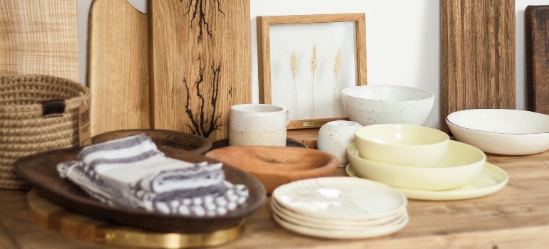 Ceramic pieces set up on a floating wooden shelf