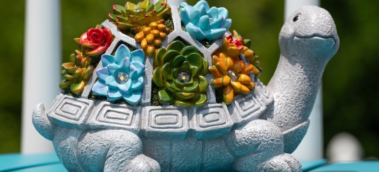 Ceramic turtle figurine with floral decoration