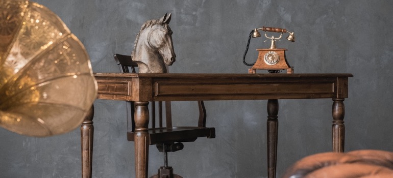 Vintage table surrounded by old decorations