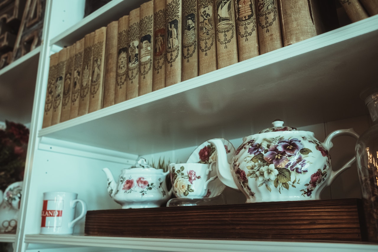 A porcelain collection displayed on a shelf.
