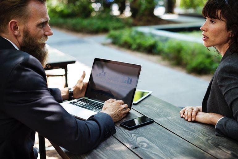 Two people in a business meeting.