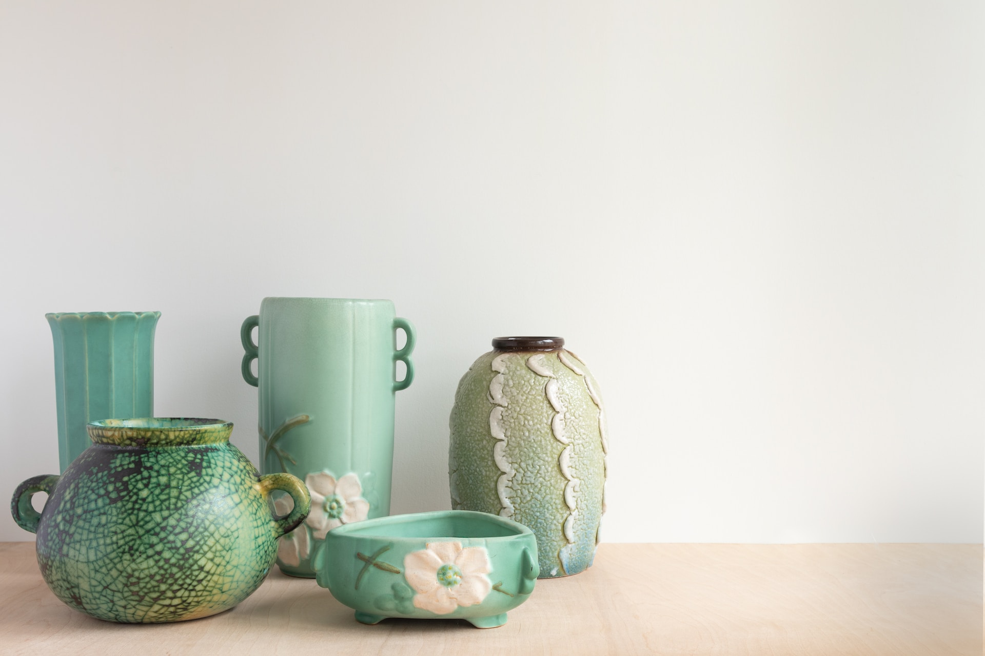 pottery in different shades of green