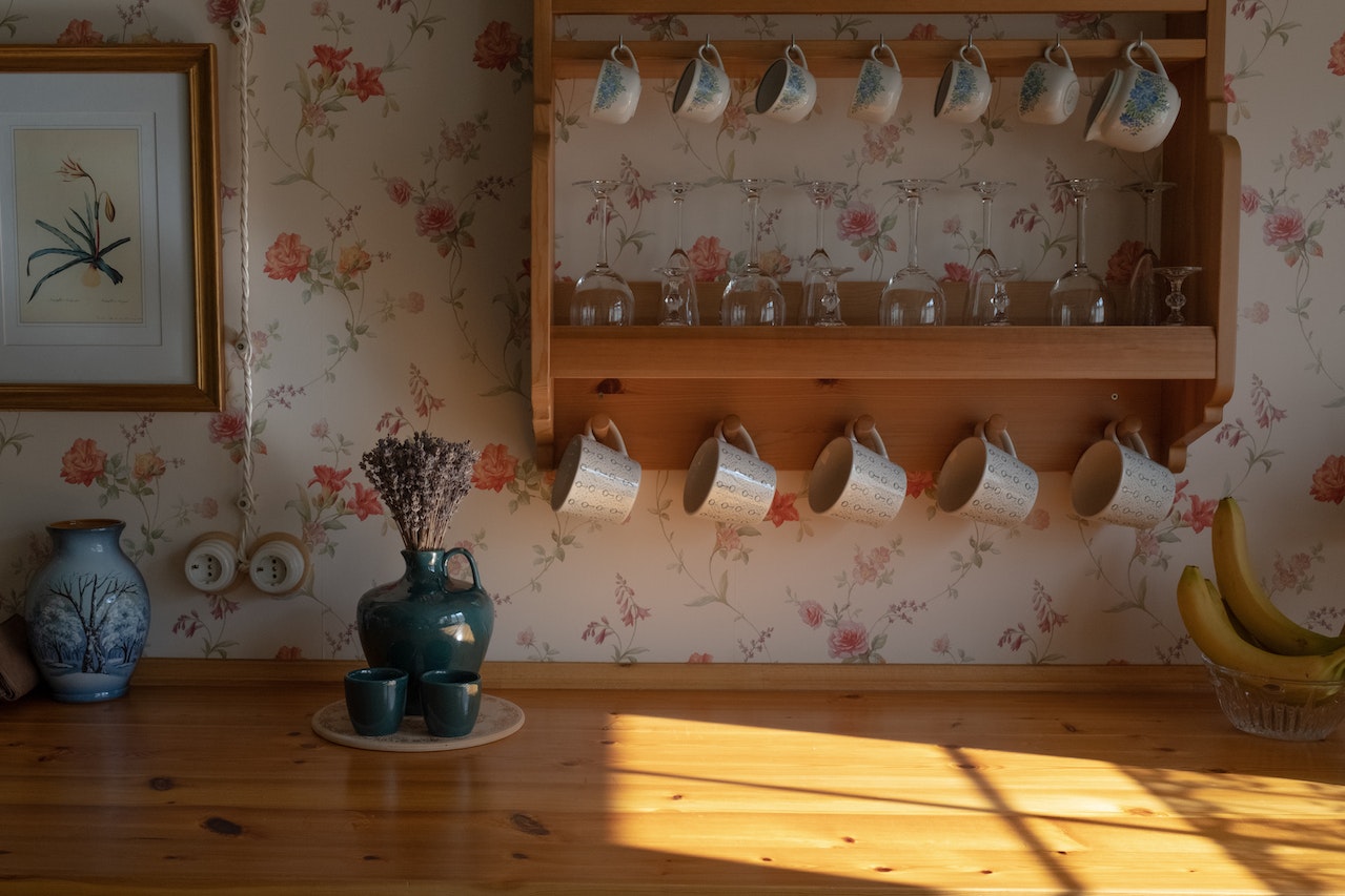  A set of ceramic cups in a kitchen used to create an eclectic home decor style.