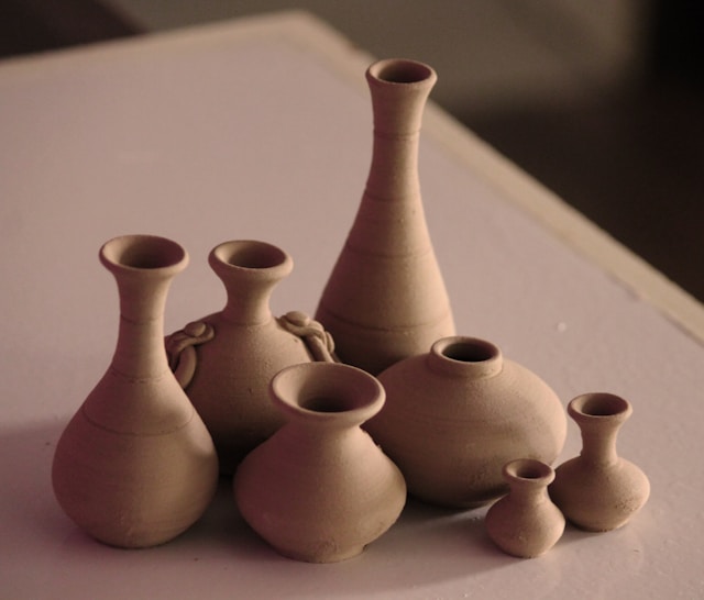 A set of pottery vases, small and big.