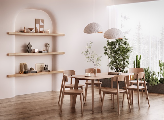 Dining room with neutral colors and a lot of plants as an example of wabi-sabi wisdom